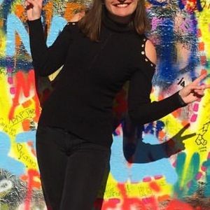 Black ribbed cold shoulder turtleneck sweater